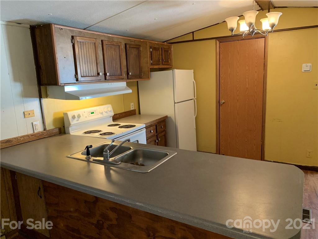 326 Indian Springs Road Clyde, NC 28721 - Photo 5 of 19 a view of a kitchen with a sink