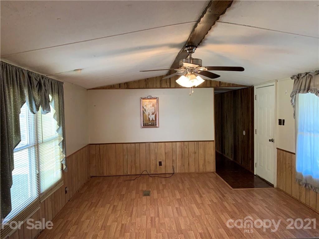 326 Indian Springs Road Clyde, NC 28721 - Photo 7 of 19 a view of an empty room with a window