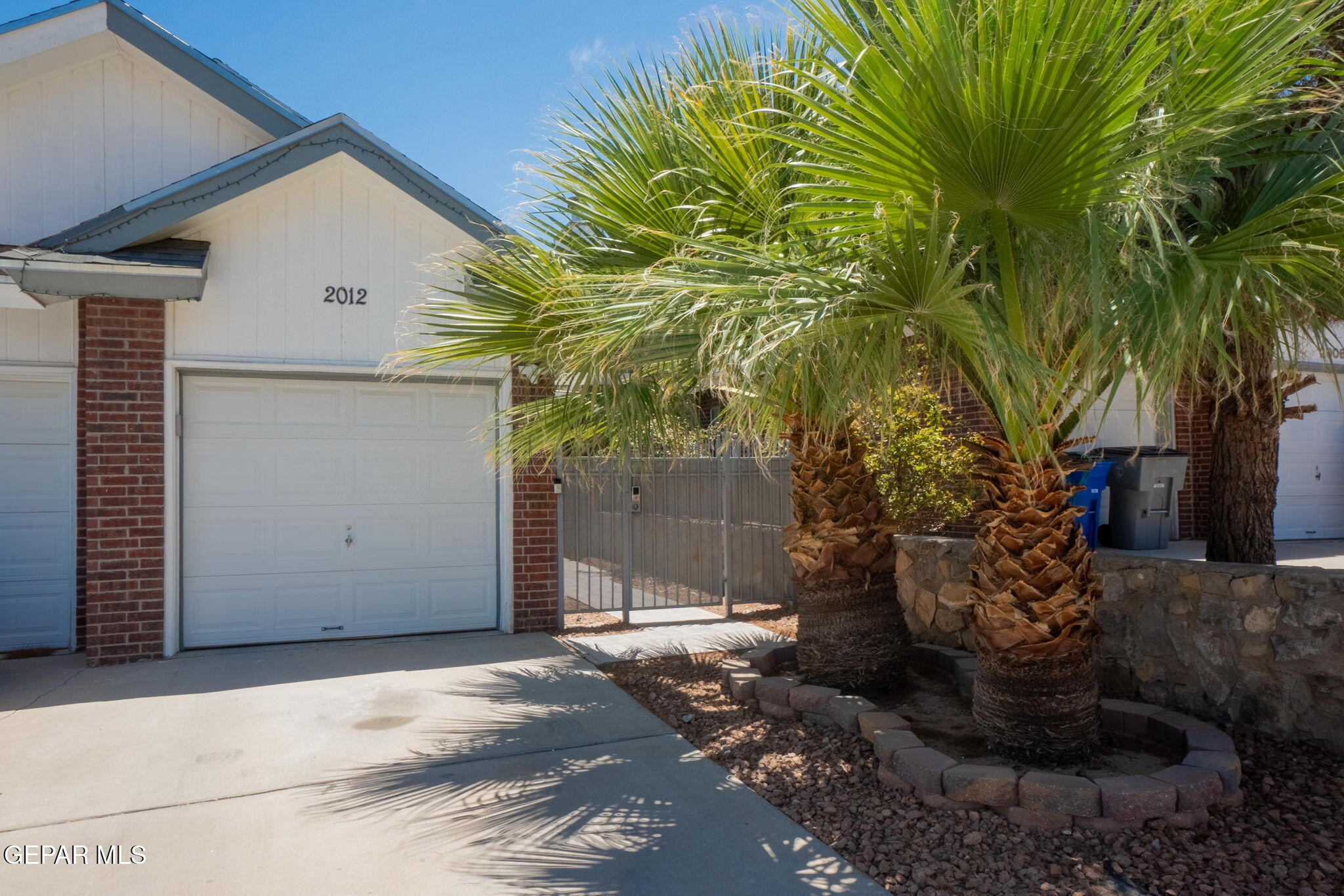 2012 Rogelio Avenue El Paso, TX 79902 - Photo 1 of 12 a front view of a house with garden