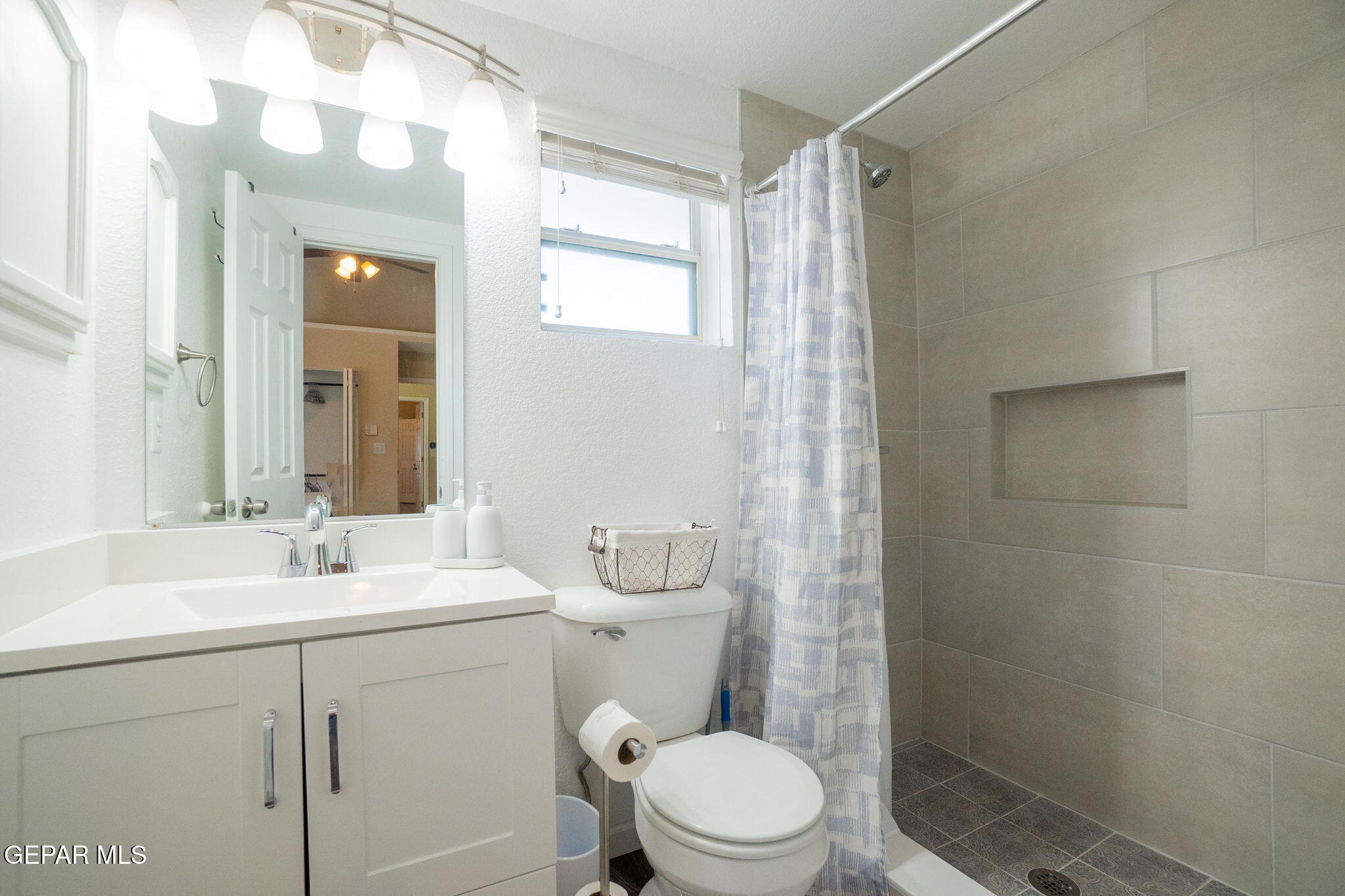 2012 Rogelio Avenue El Paso, TX 79902 - Photo 12 of 12 a bathroom with a sink a toilet and shower