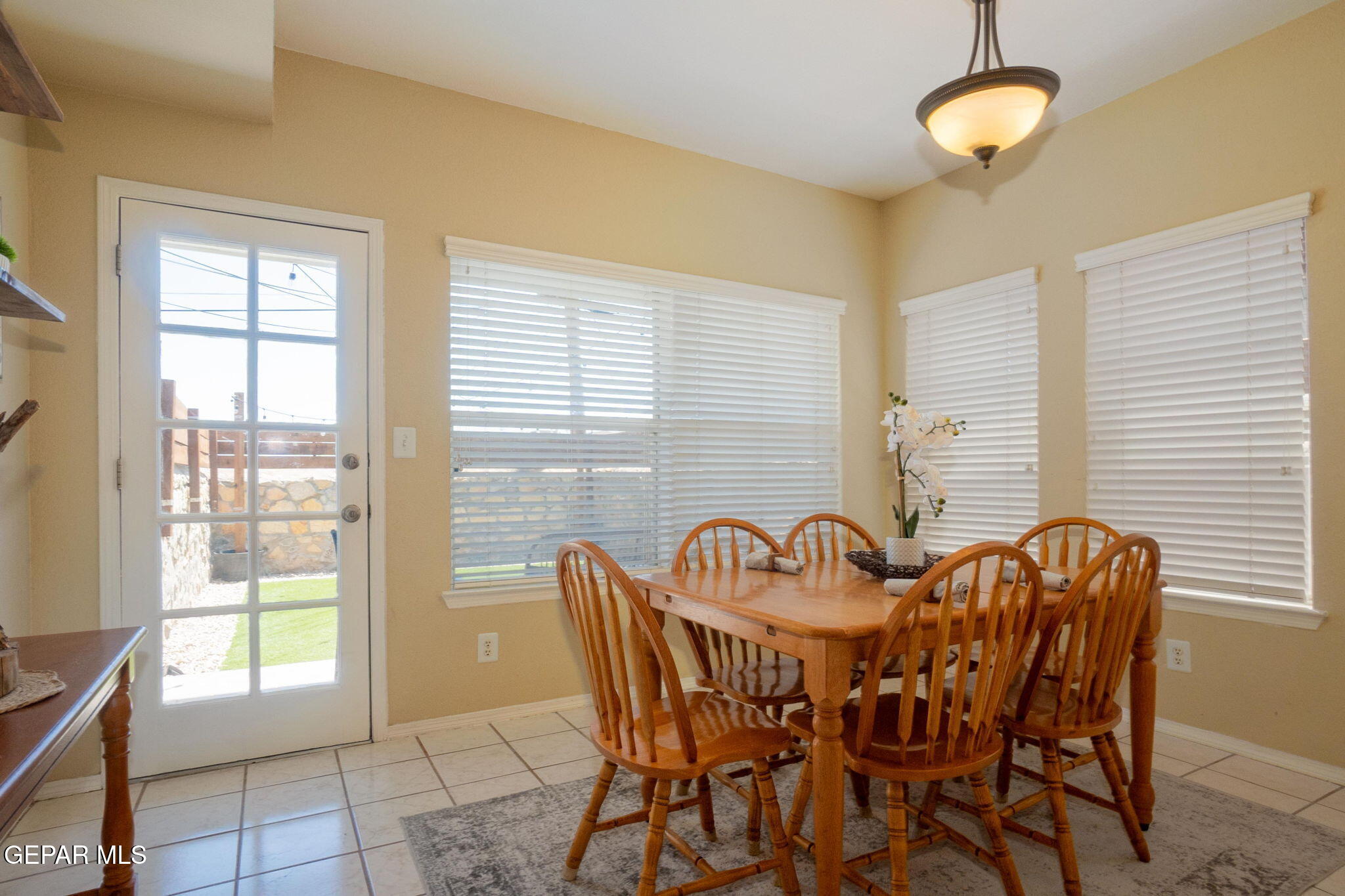 2012 Rogelio Avenue El Paso, TX 79902 - Photo 8 of 12 a view of a dining room with furniture and chandelier