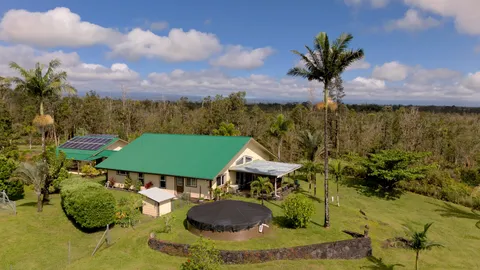 a view of a backyard with a garden and mountain view