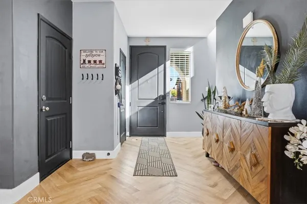 a kitchen with cabinets and chairs