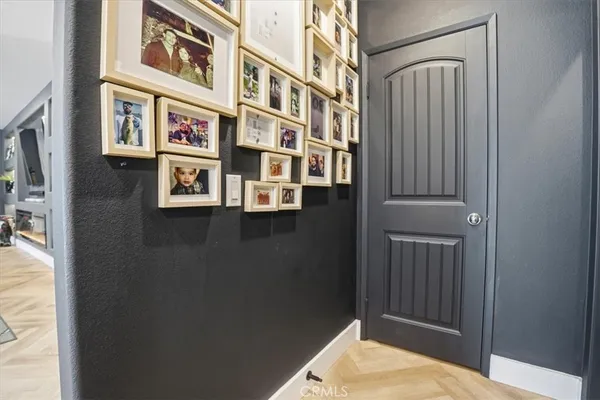 a living room with furniture and kitchen view