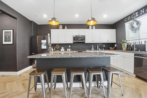 a kitchen with a sink cabinets and window