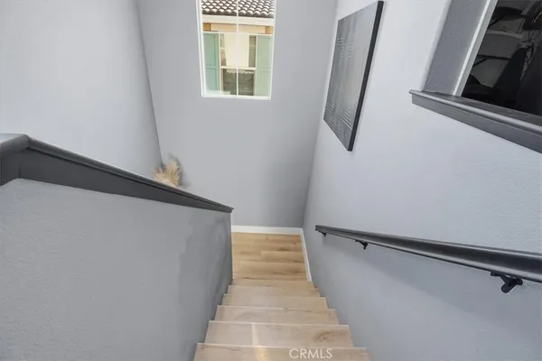 a white toilet sitting next to a bathroom sink