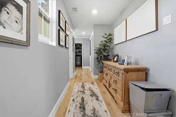 a bedroom with a bed and a dresser in it