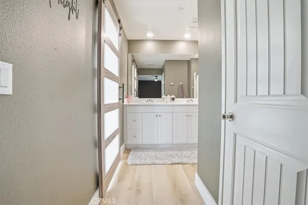 a bedroom with a bed a table and chair