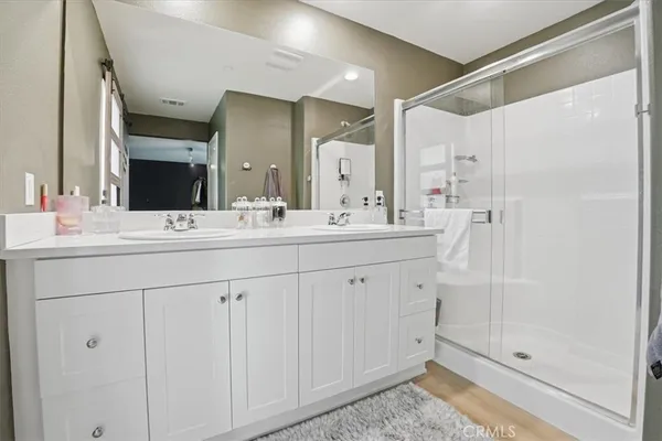 a bathroom with a sink a toilet and shower curtain