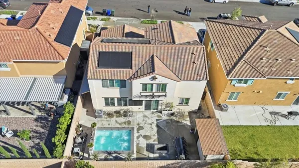 an aerial view of residential houses and outdoor space