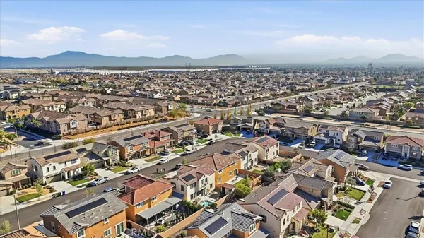 a bedroom with bed and a mirror