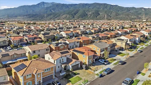 a large white kitchen with lots of counter space and window