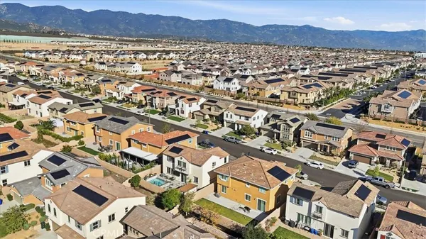 a kitchen with stainless steel appliances granite countertop a sink a stove and a wooden floors