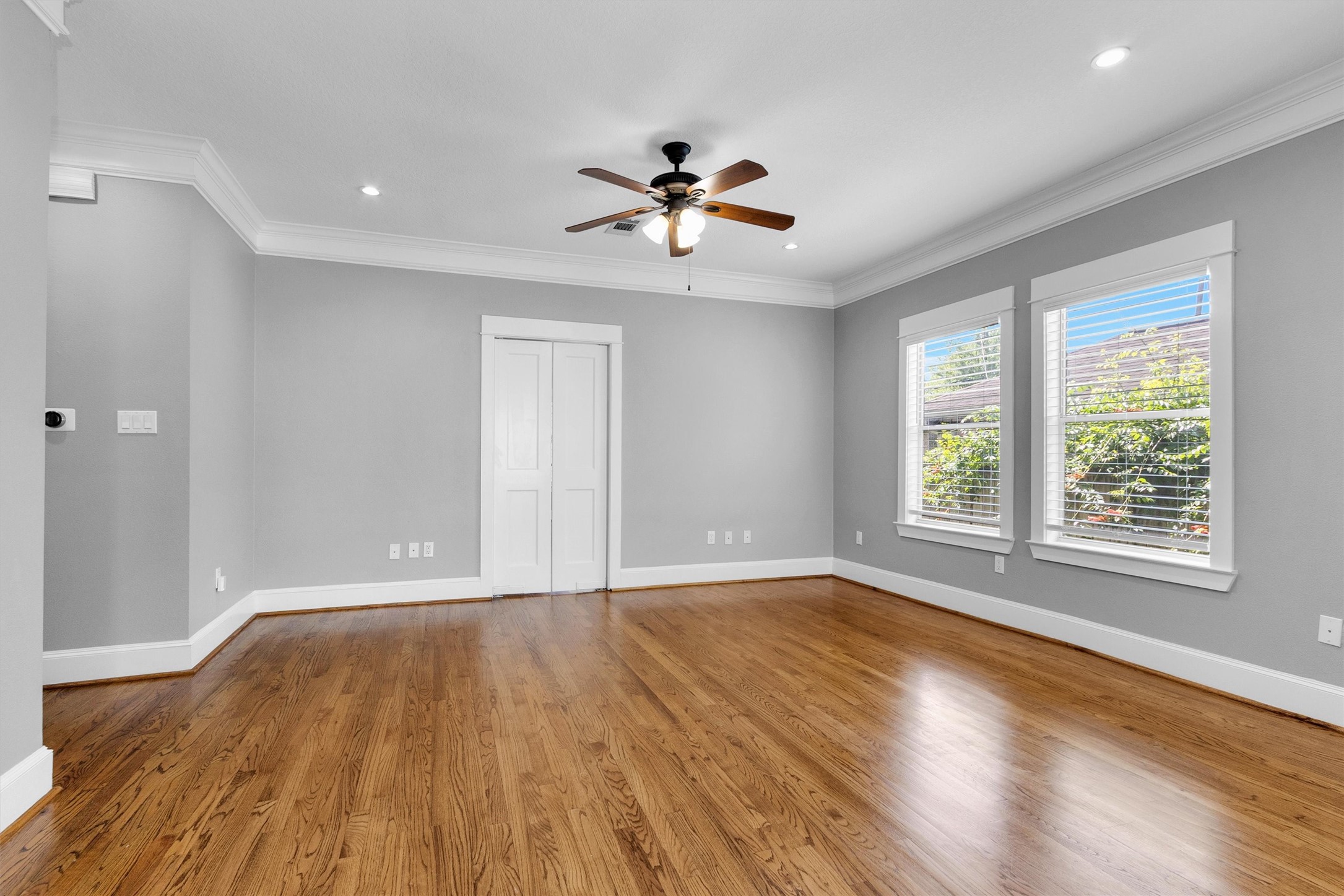 304 Vincent Street Houston, TX 77009 - Photo 8 of 36 wooden floor in an empty room with a window