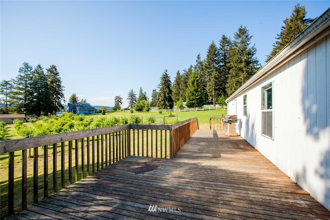 5390 East Harbor Road Freeland, WA 98249 - Photo 11 of 17 a view of a street with wooden fence