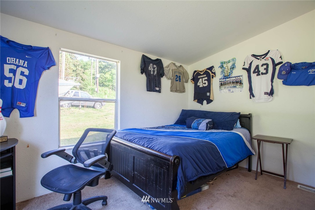 5390 East Harbor Road Freeland, WA 98249 - Photo 15 of 17 a bedroom with a bed and a window