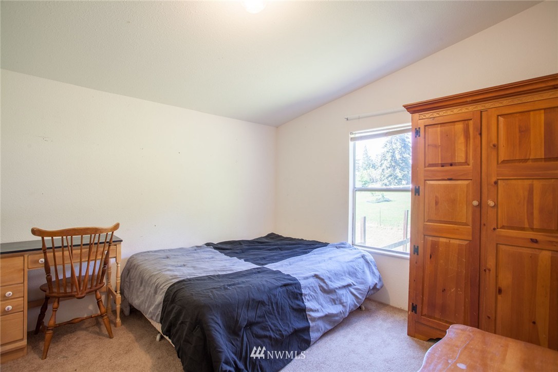5390 East Harbor Road Freeland, WA 98249 - Photo 16 of 17 a bedroom with a bed and a window