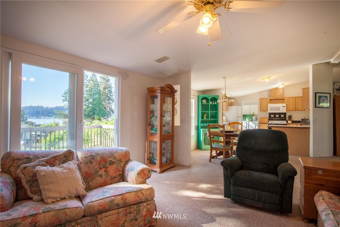5390 East Harbor Road Freeland, WA 98249 - Photo 7 of 17 a living room with furniture and a large window