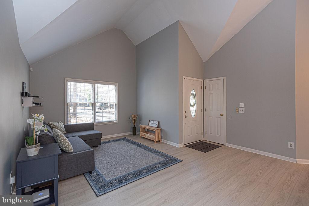47 Falcon Bridge Road Ocean Pines, MD 21811 - Photo 13 of 78 a living room with furniture and a window