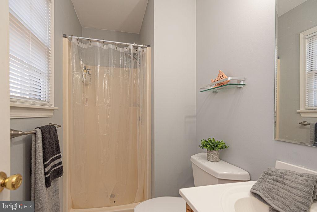 47 Falcon Bridge Road Ocean Pines, MD 21811 - Photo 21 of 78 a bathroom with a toilet and a shower