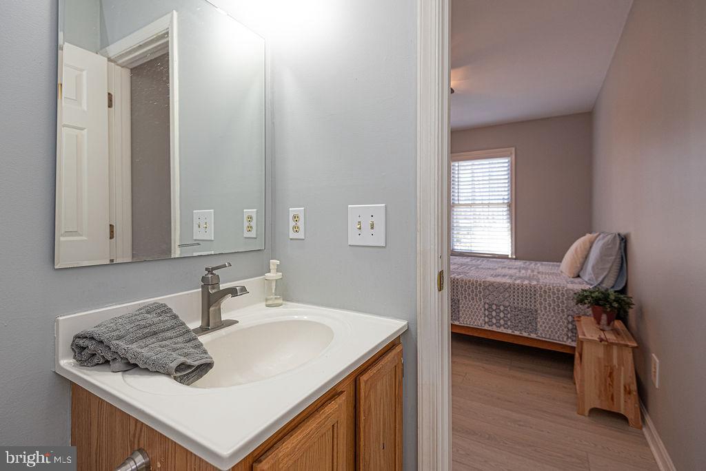 47 Falcon Bridge Road Ocean Pines, MD 21811 - Photo 22 of 78 a en suite bathroom with a sink and a mirror