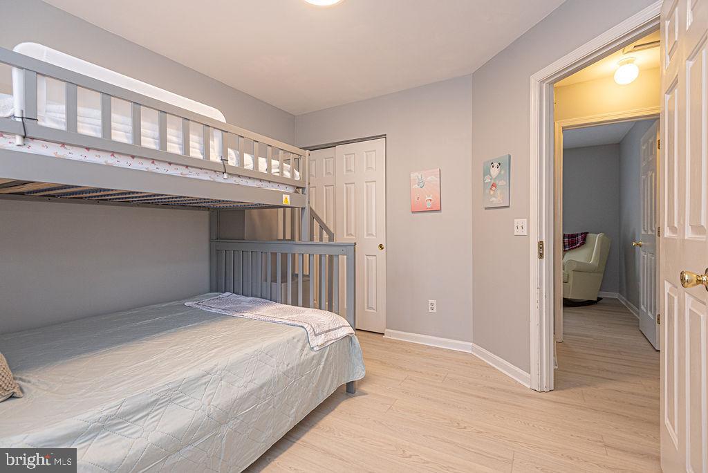 47 Falcon Bridge Road Ocean Pines, MD 21811 - Photo 27 of 78 a bedroom with a bed and a window
