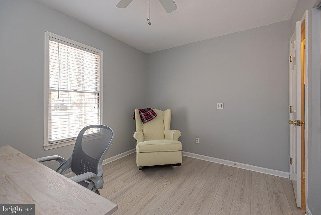 47 Falcon Bridge Road Ocean Pines, MD 21811 - Photo 30 of 78 a living room with furniture and a window