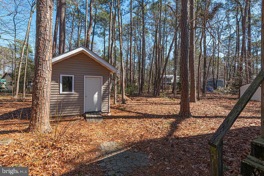 47 Falcon Bridge Road Ocean Pines, MD 21811 - Photo 37 of 78 a front view of a house with a yard