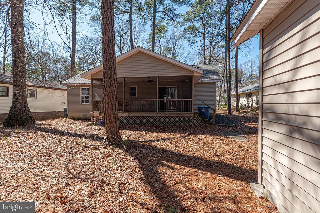 47 Falcon Bridge Road Ocean Pines, MD 21811 - Photo 38 of 78 a front view of a house with garden