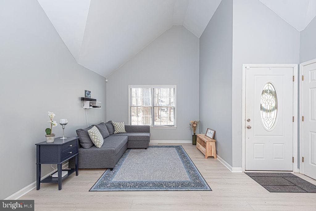 47 Falcon Bridge Road Ocean Pines, MD 21811 - Photo 6 of 78 a living room with furniture rug and window