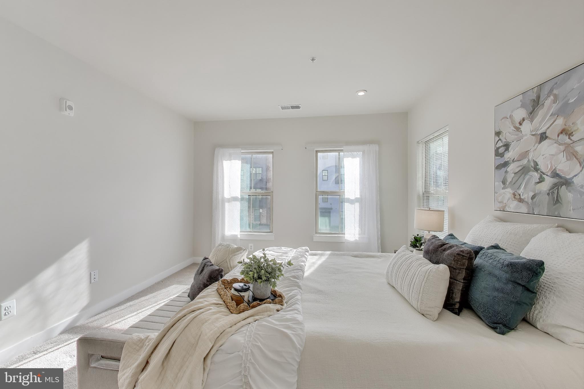 10020 Ruffian Way, Unit E Laurel, MD 20723 - Photo 12 of 30 a bedroom with a bed and a large window