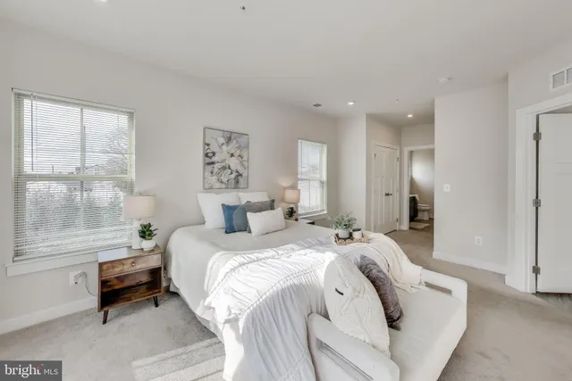 a living room with furniture and windows