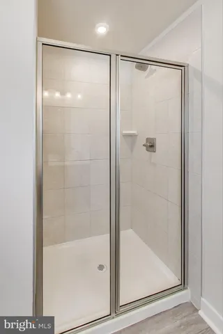 a spacious bedroom with a bed and a window