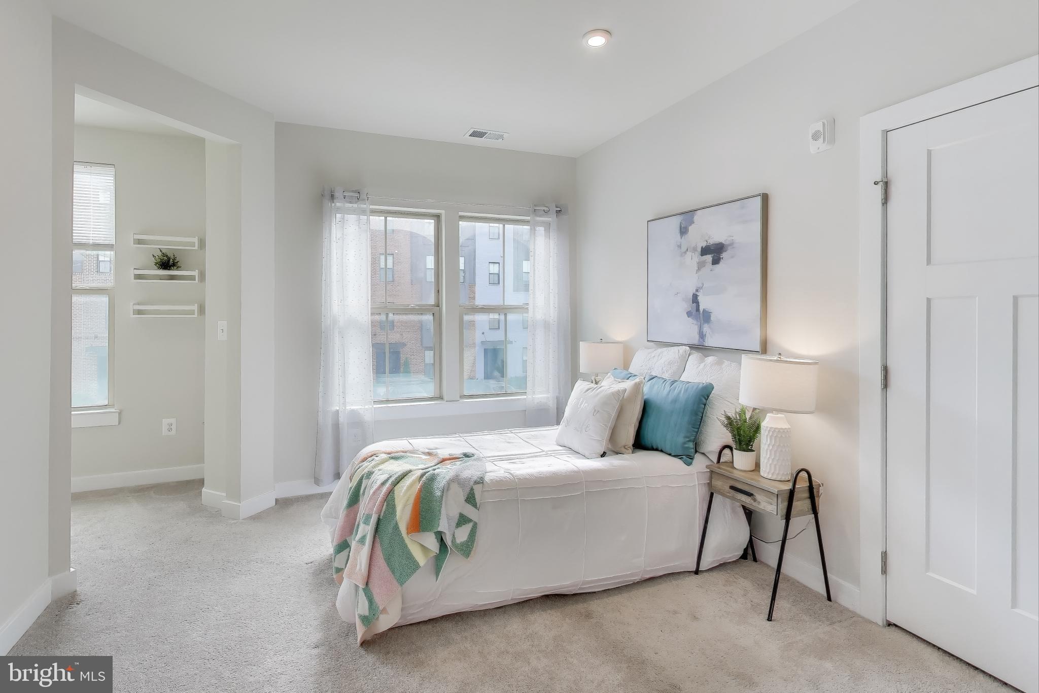 10020 Ruffian Way, Unit E Laurel, MD 20723 - Photo 17 of 30 a bedroom with a bed and a window