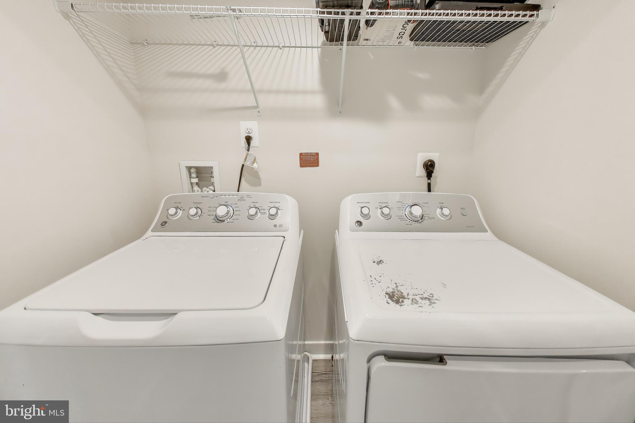 10020 Ruffian Way, Unit E Laurel, MD 20723 - Photo 23 of 30 a utility room with dryer and washer