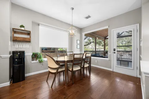 a dining room with furniture window wooden floor