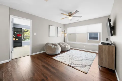 a living room with couch and a flat screen tv
