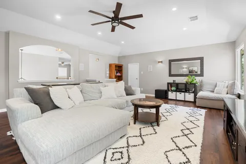 a living room with furniture and white walls