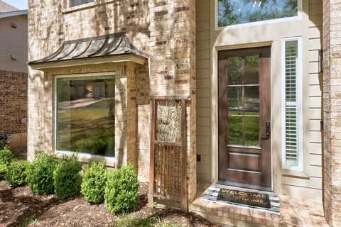 a front view of a house with a glass door