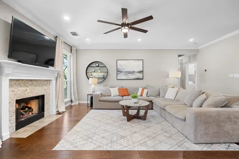 a living room with furniture and a fireplace