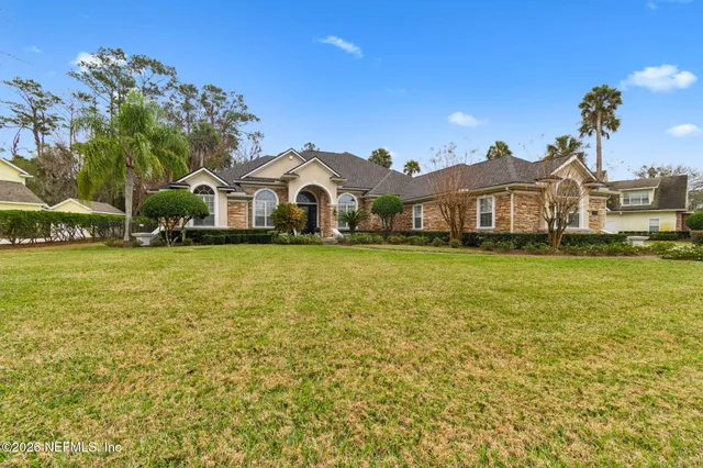 a front view of a house with a yard