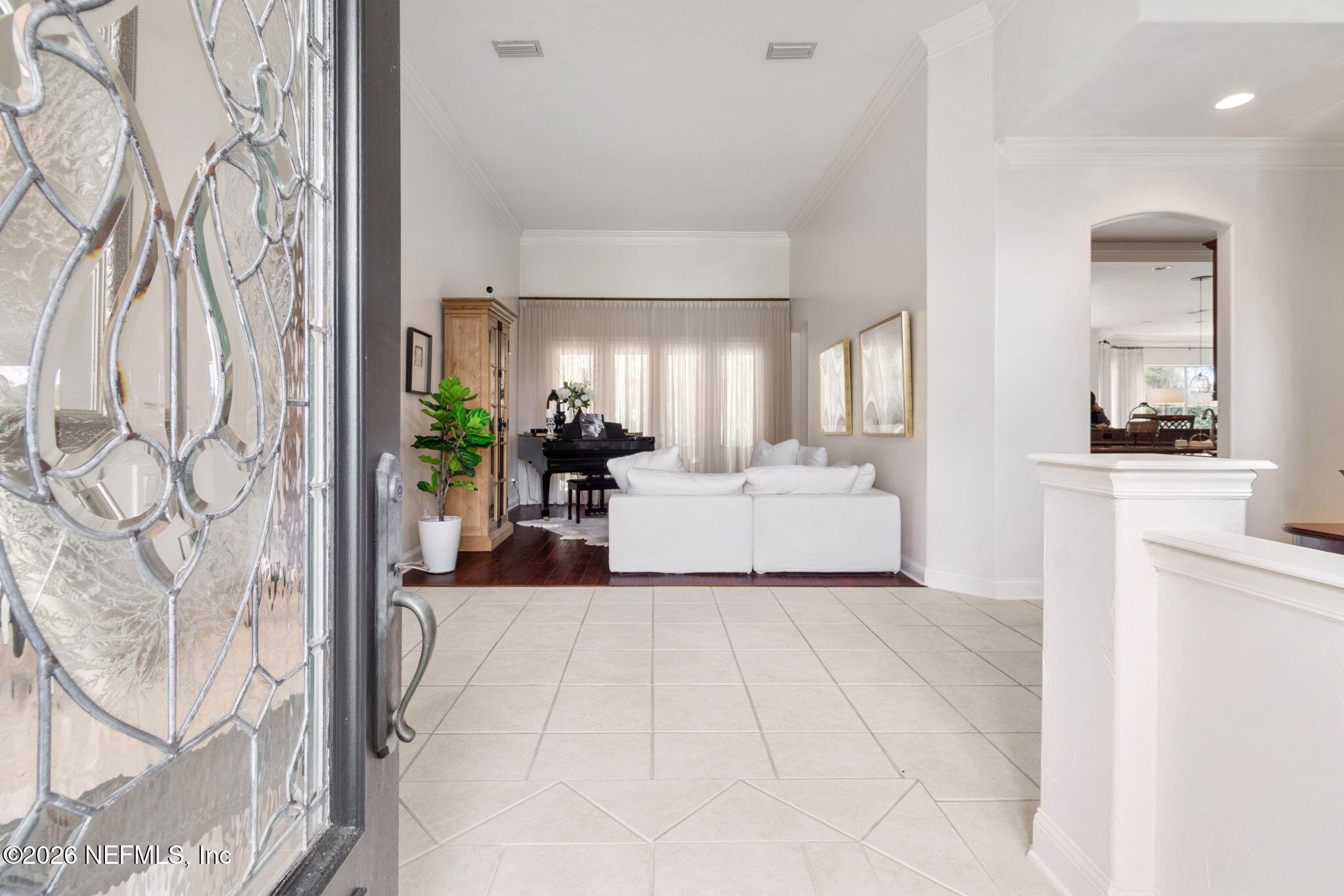 113 Natures Way Ponte Vedra Beach, FL 32082 - Photo 12 of 96 a view of a living room and kitchen with furniture and a fireplace