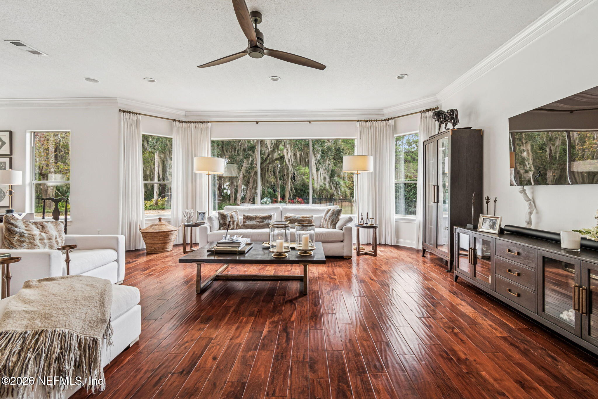 113 Natures Way Ponte Vedra Beach, FL 32082 - Photo 32 of 96 a living room with furniture and a flat screen tv with wooden floor