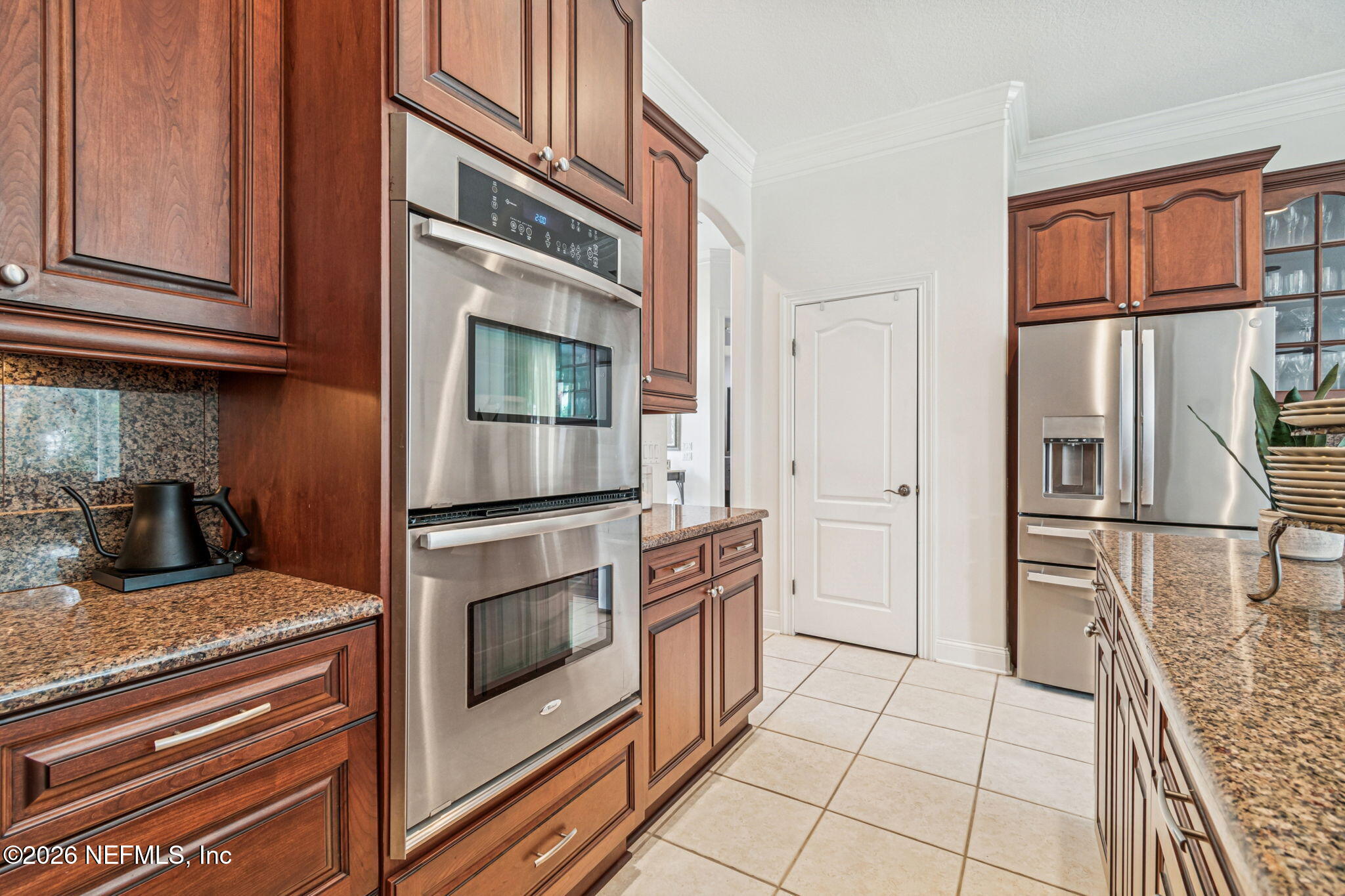 113 Natures Way Ponte Vedra Beach, FL 32082 - Photo 36 of 96 a kitchen with granite countertop cabinets and steel stainless steel appliances