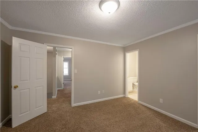 an empty room with closet area