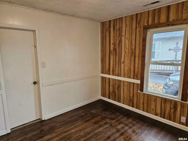 a view of a porch with wooden floor