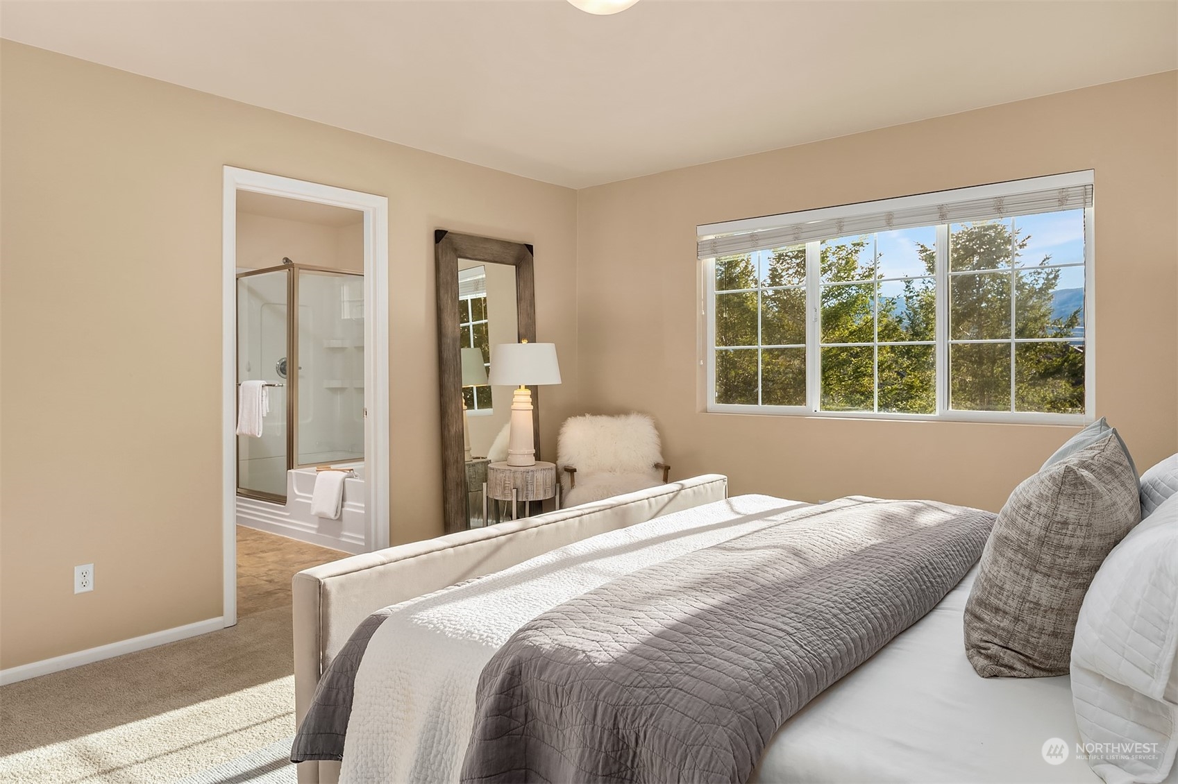 6608 West Crestview Loop Southeast Snoqualmie, WA 98065 - Photo 19 of 29 a bedroom with a large bed and a window