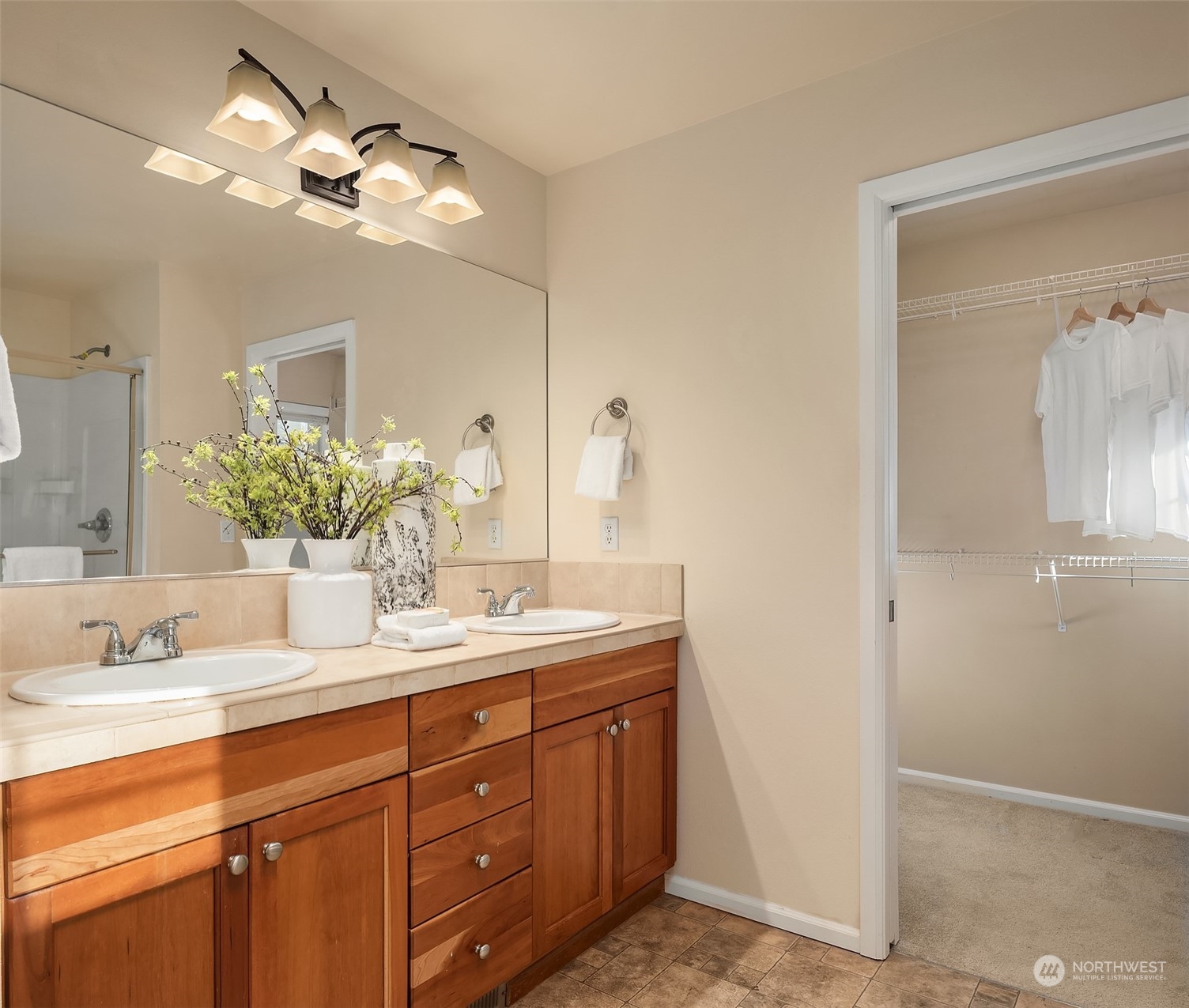 6608 West Crestview Loop Southeast Snoqualmie, WA 98065 - Photo 20 of 29 a bathroom with a double vanity sink and a mirror