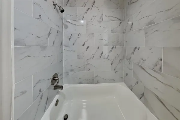 a bathroom with bathtub
