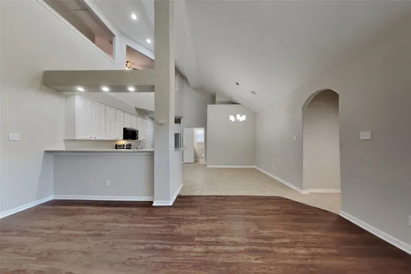 a view of kitchen with cabinets and wooden floor